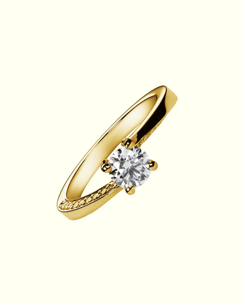 Essential solitaire ring with side diamonds