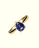 Chromia solitaire ring with blue sapphires