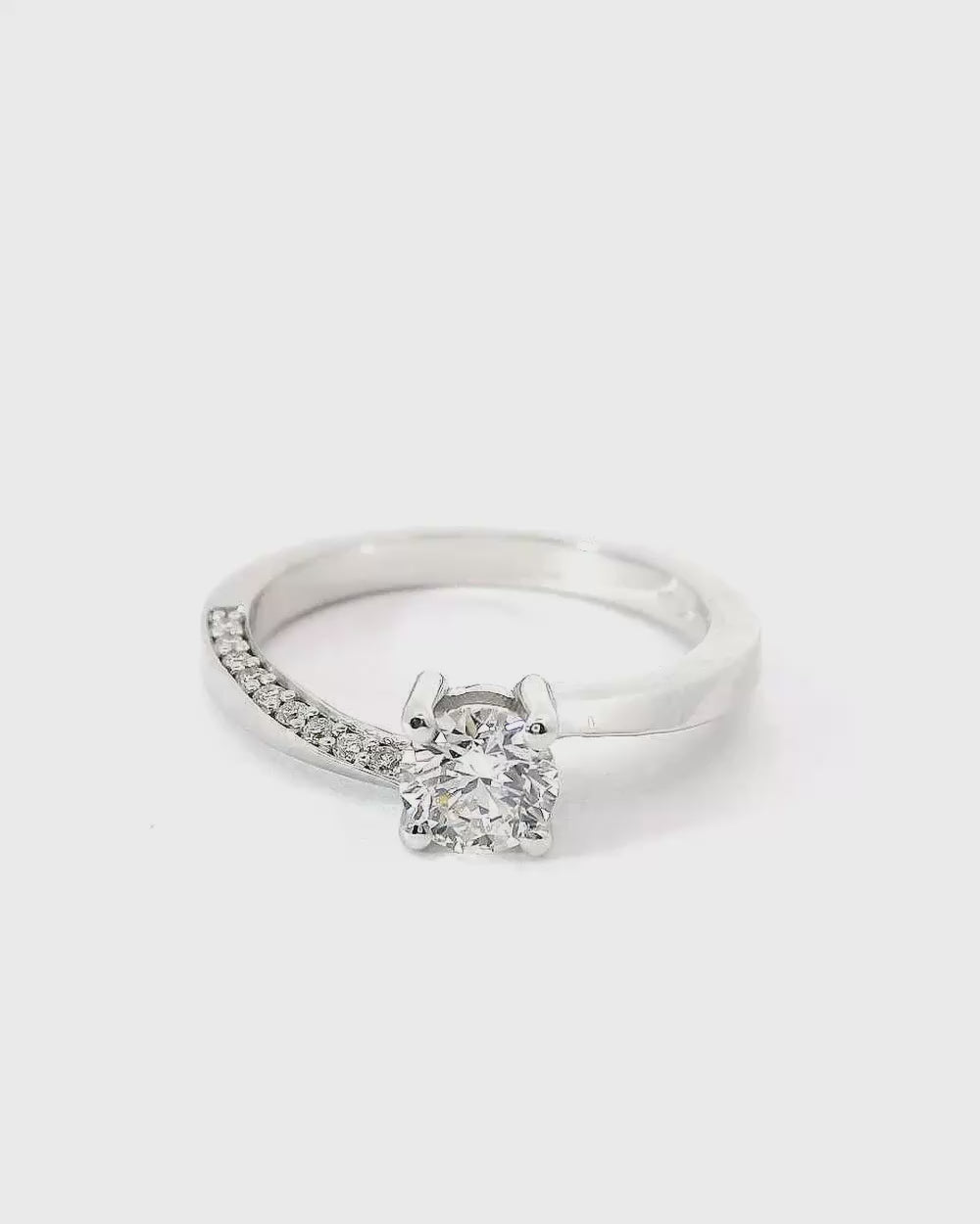 Essential solitaire ring with side diamonds