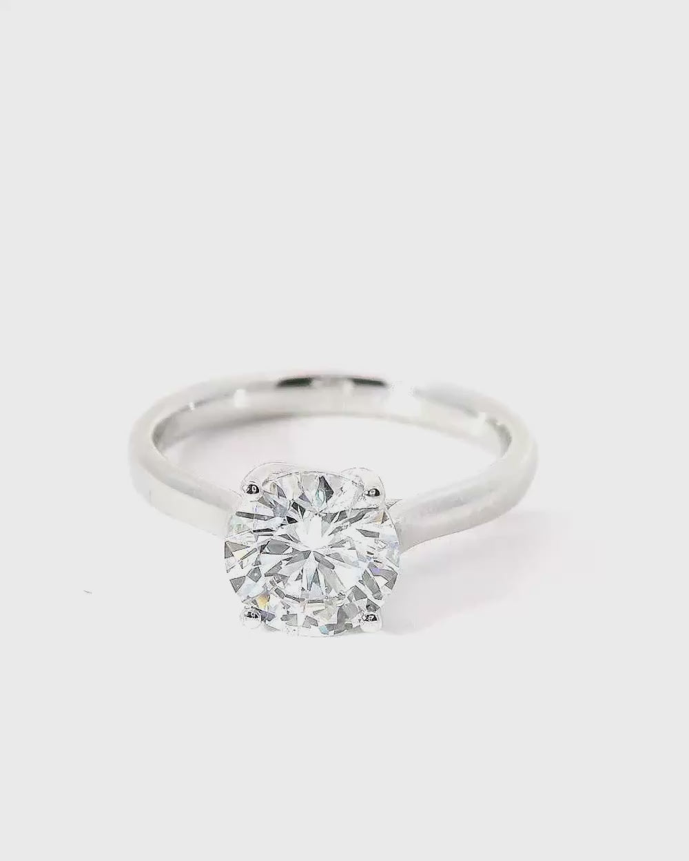 Luce cross band solitaire ring